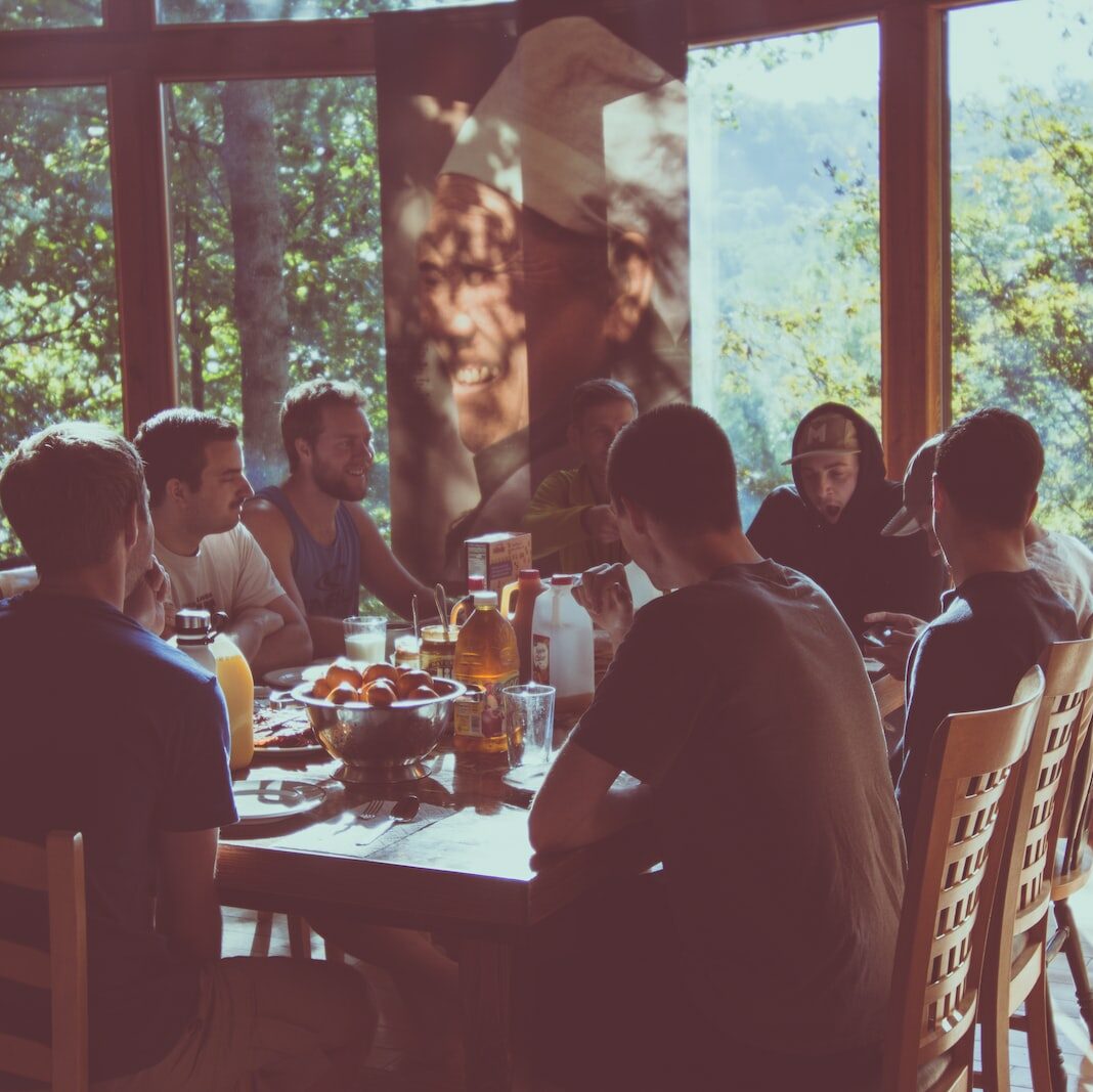 a group of people eating in a restaurant